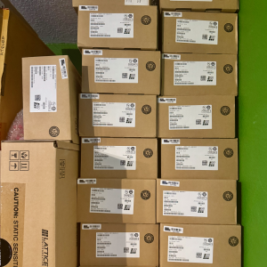 Stack of Lattice FPGA boxes labeled LFE5U-25F-6BG381C showing bulk inventory in original manufacturer packaging